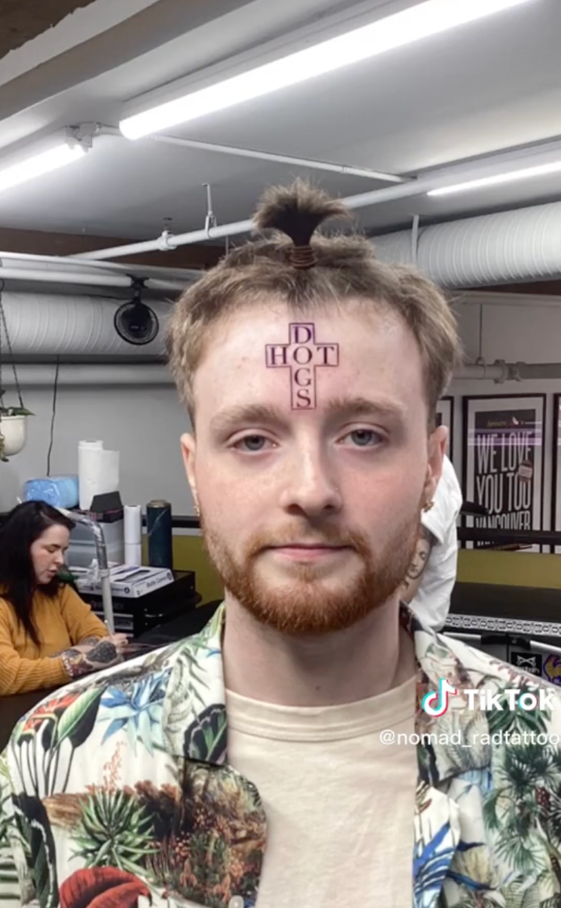 Lad gets hot dog cross tattooed on head leaving people completely baffled