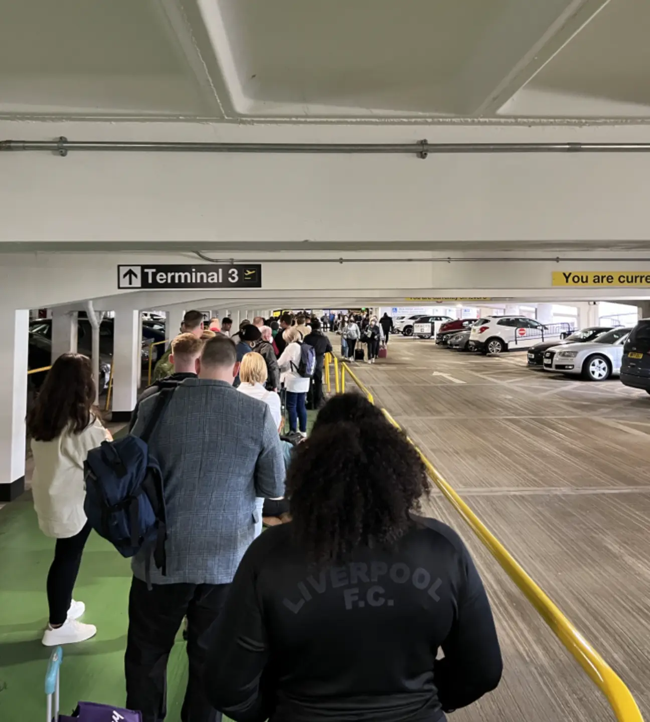 Furious passengers storm behind carousel curtain to find lost bags at  Manchester airport