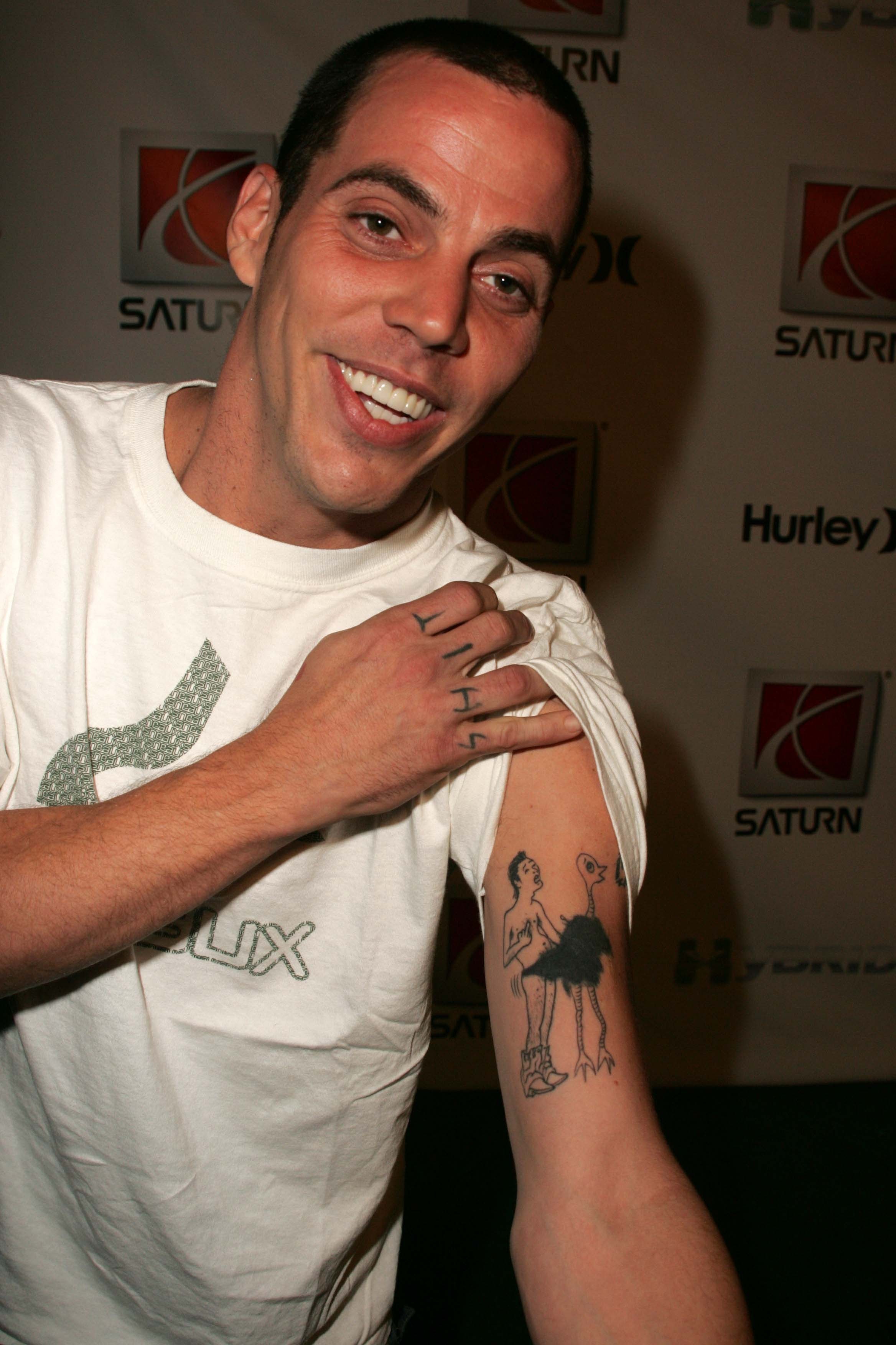 Steve o arm tattoo