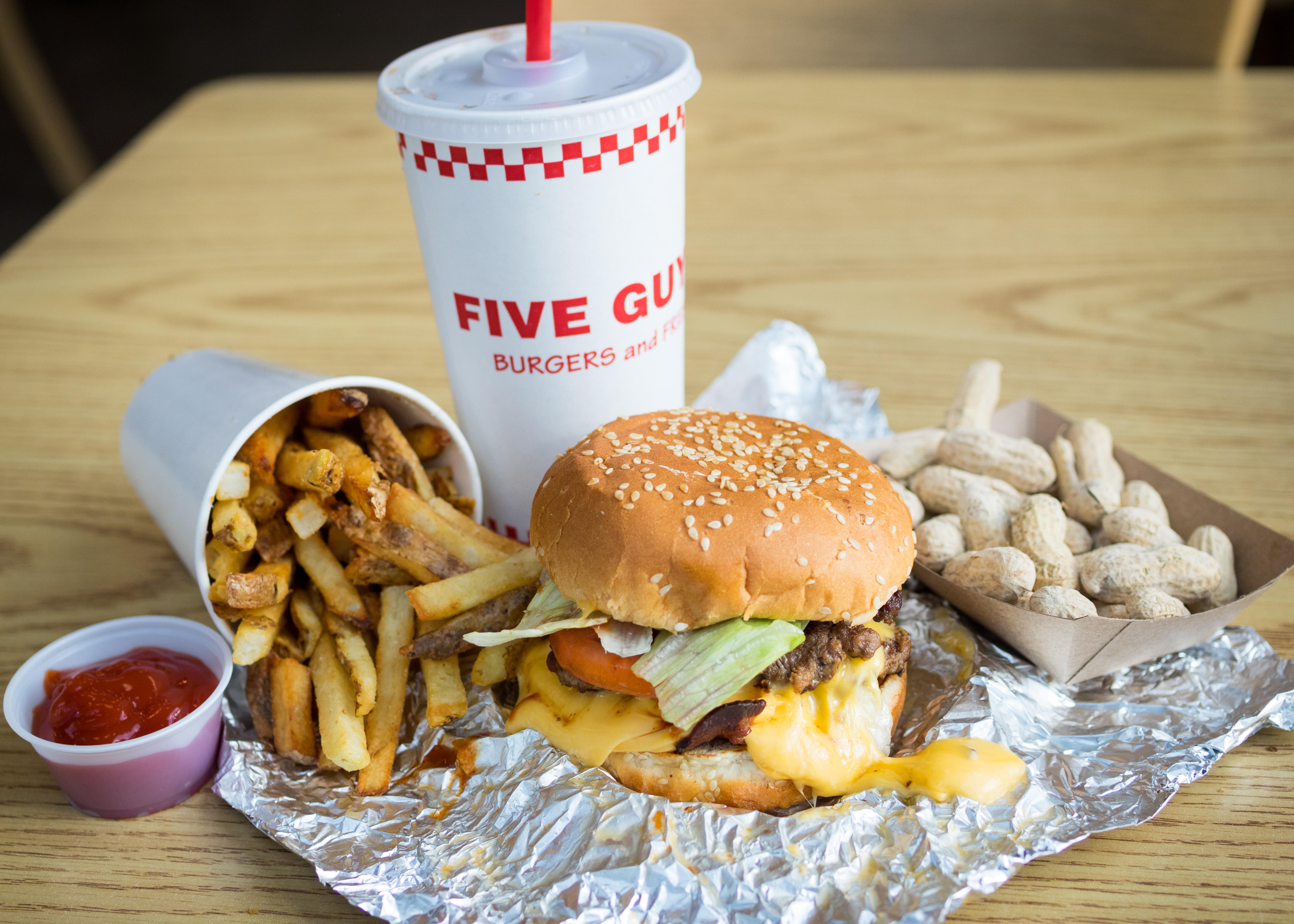 The Real Reason You Always See Bags Of Potatoes Inside Five Guys