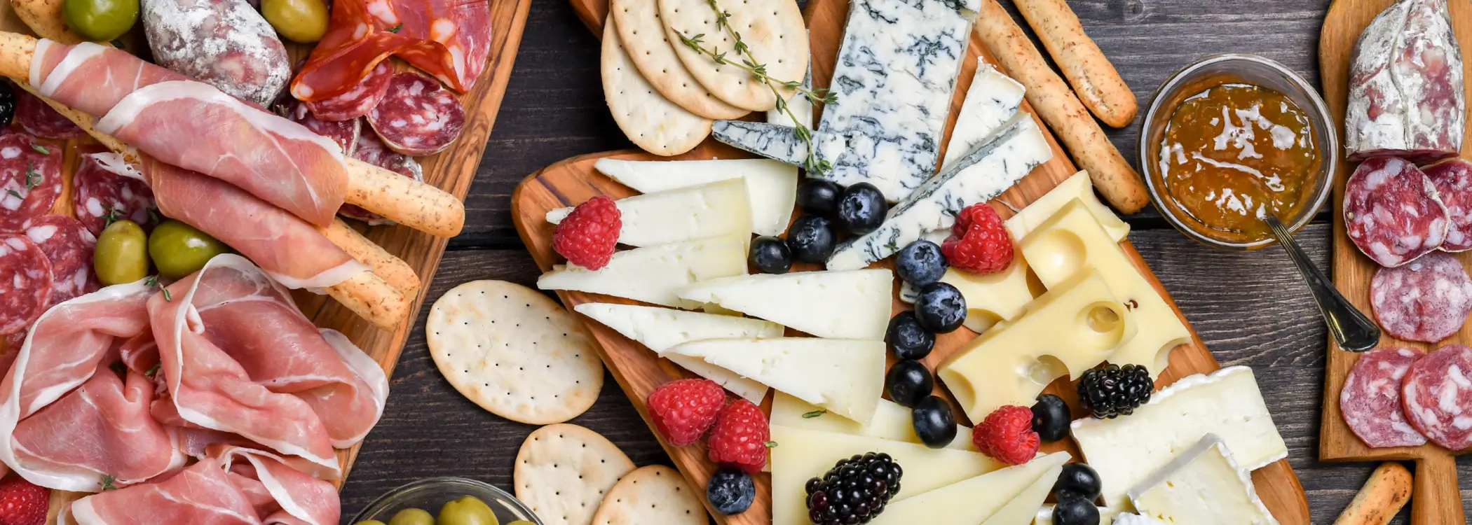 Charcuterie board filled with cheese, fruits and meats
