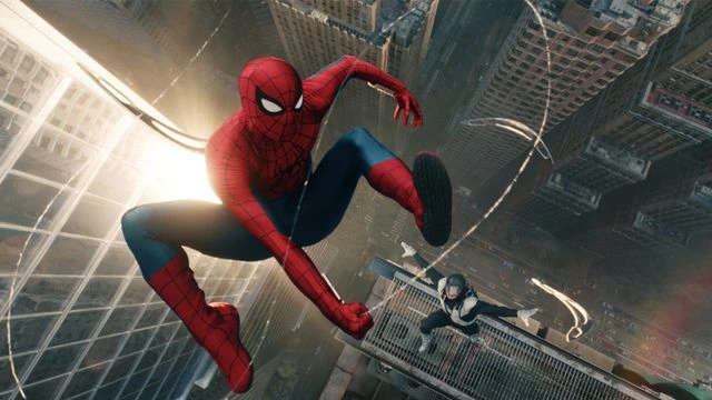 Spider-Man poster of the character casting a web and swinging between high rise buildings in New York city with a villain closely chasing after him. 