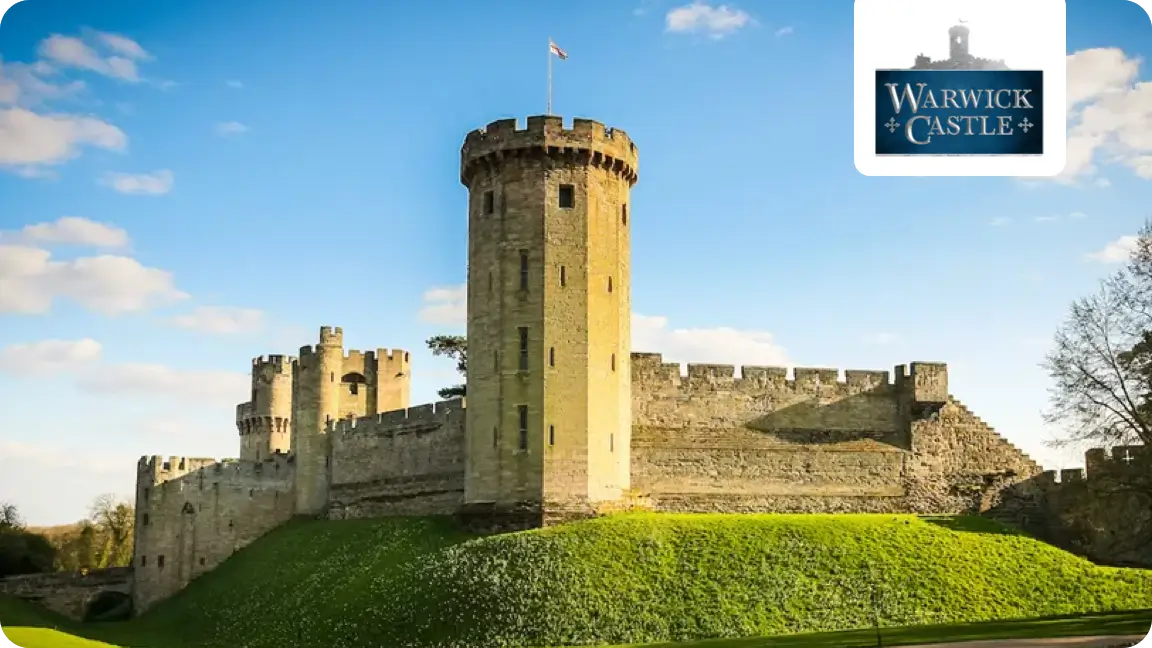 Warwick Castle in the sunlight with blue skies