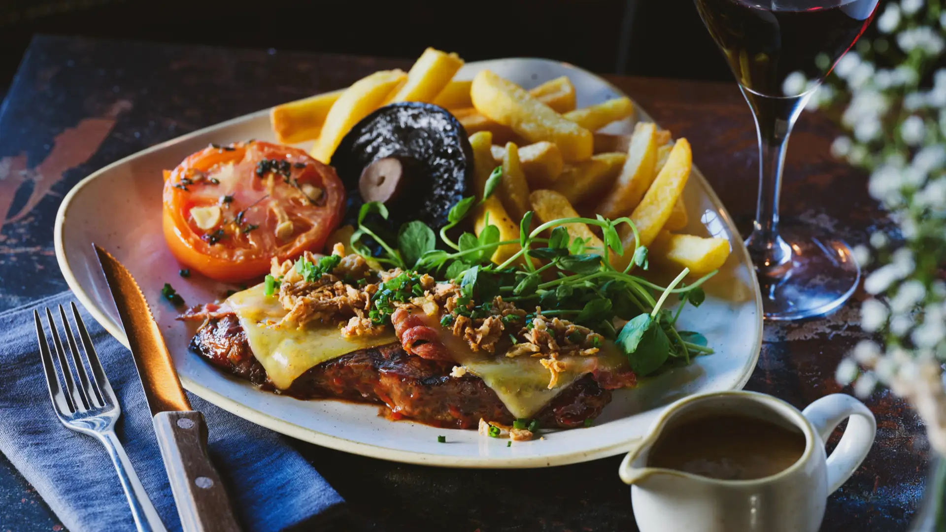 plate of pub food including mushroom, chips and steak