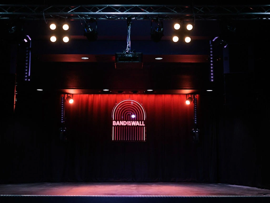 bandonthewall stage with red lighting