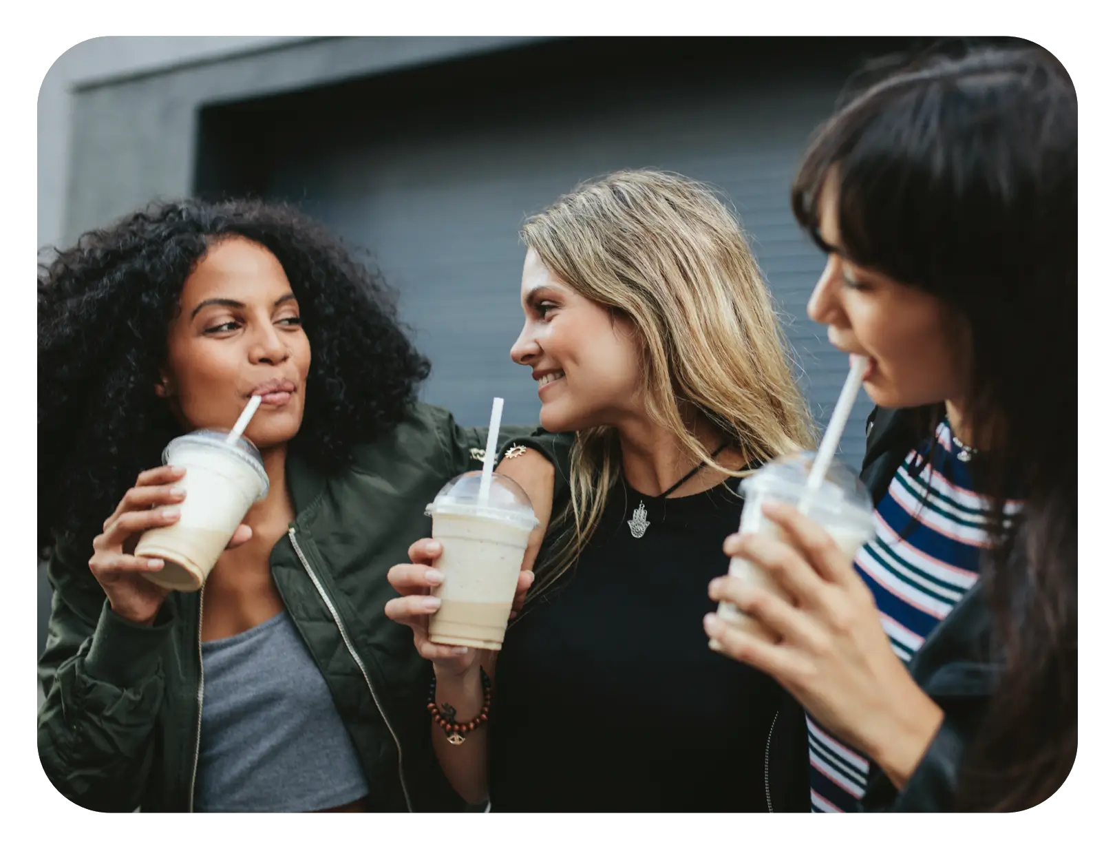 3 women chatting over iced drinks