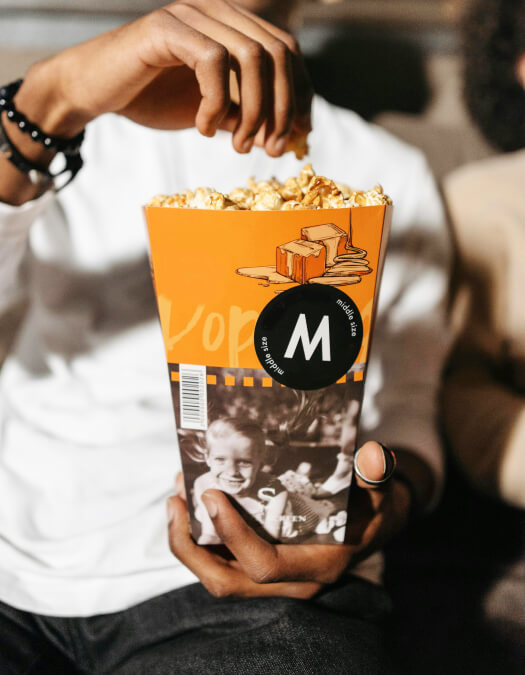 Hand reaching for popcorn