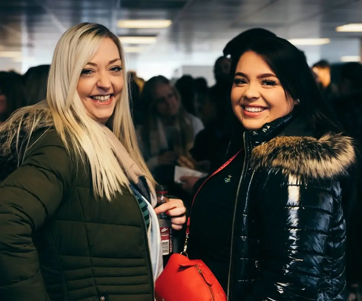 Two women smiling 