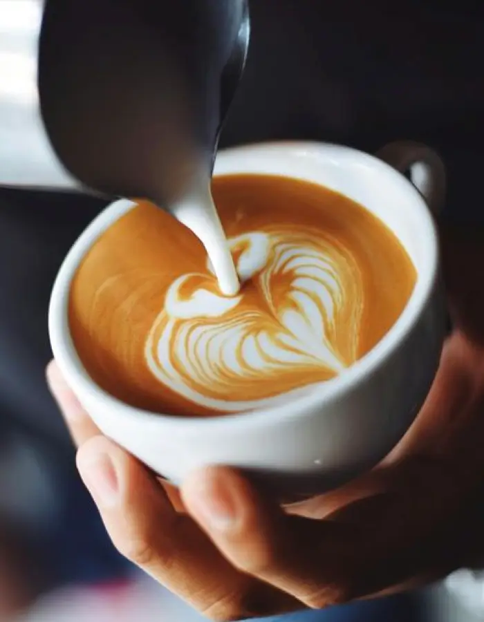 Barista pouring a coffee