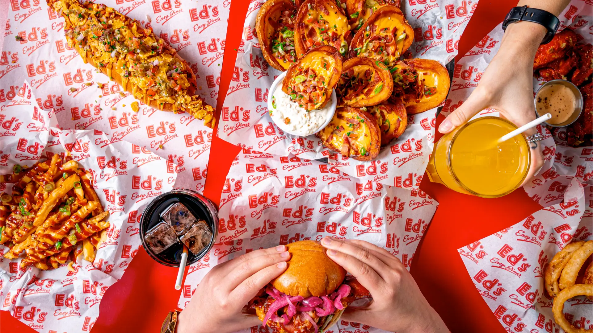 selection of american diner style food including burgers, hot dogs and sodas