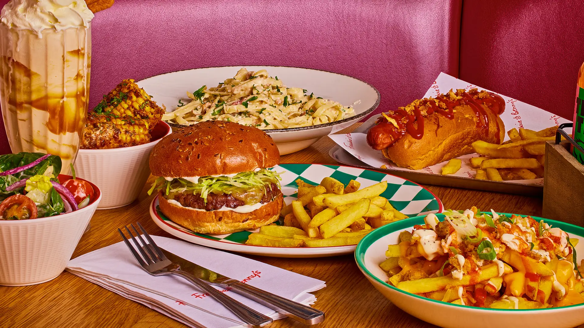 selection of italian-american food including burger, hot dog, pasta and milkshakes