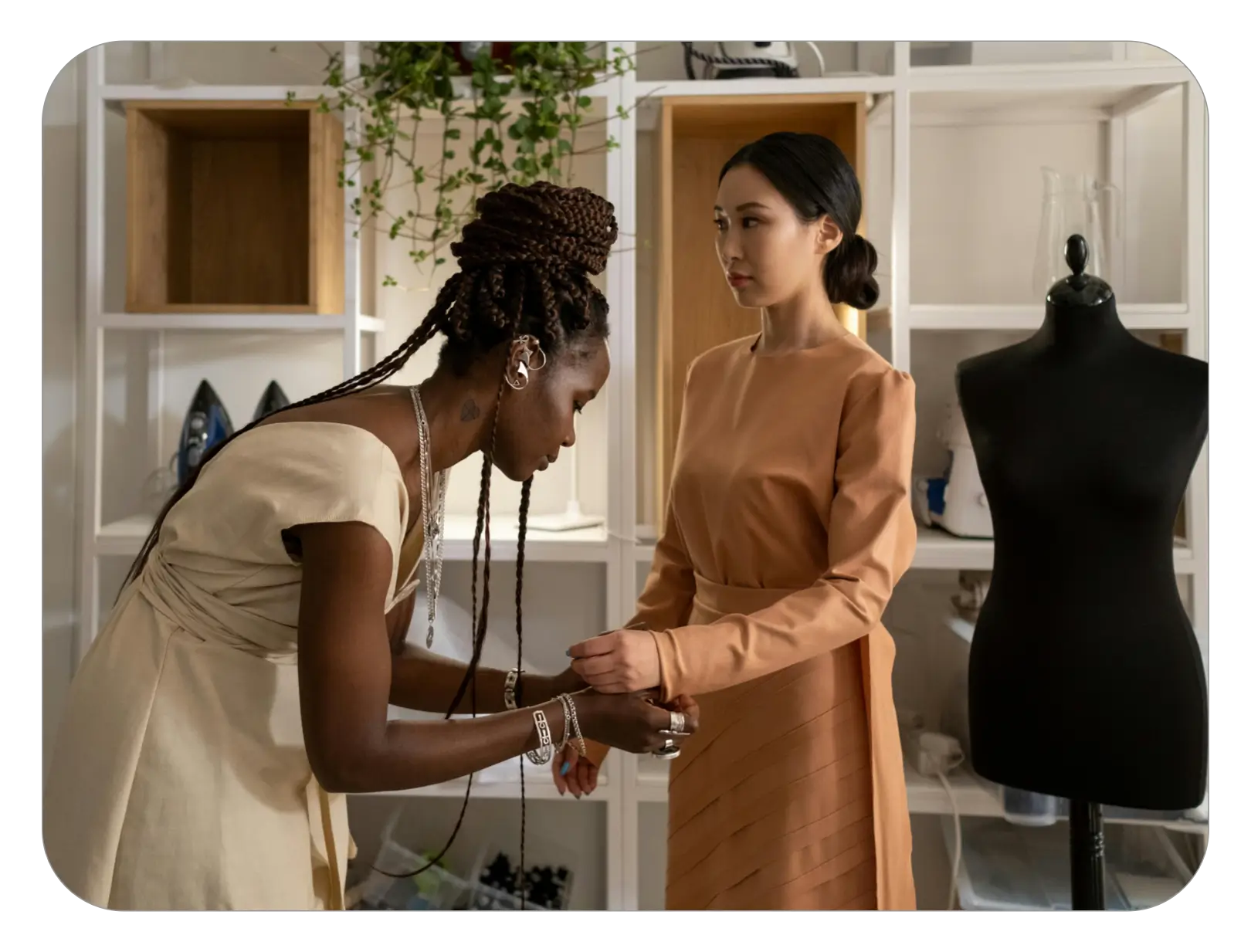 A lady having a dress fitting