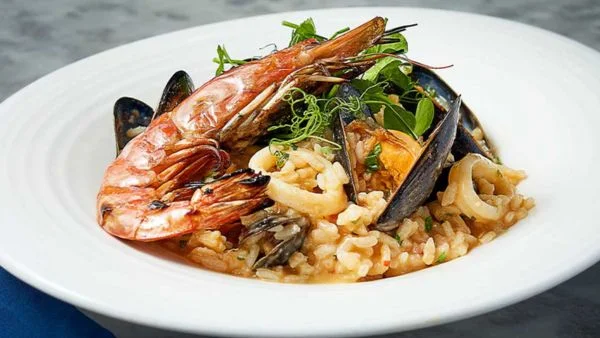 Close up shot of Carluccio's Risotto di Mare prawn including muscles and squid.