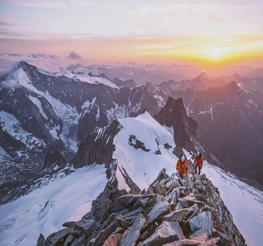 Mountains with Sunset and two people in the North Face Clothes