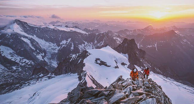 Mountains with Sunset and two people in the North Face Clothes