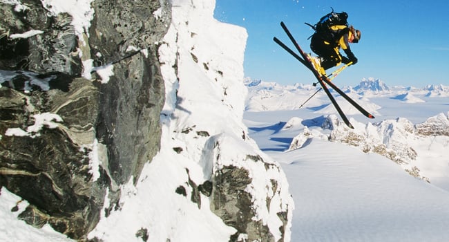 Skier jumps from mountain