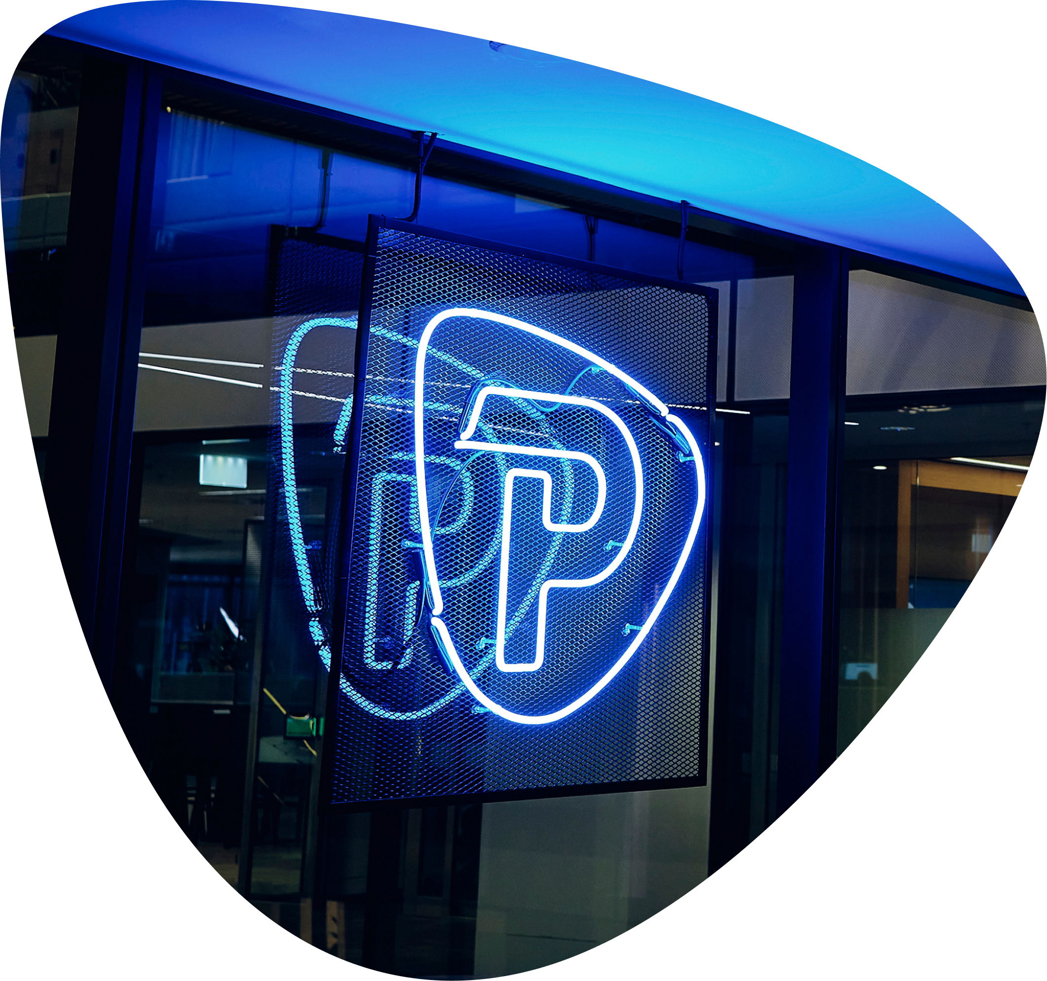 Pepperstone neon logo sign at a company office entrance