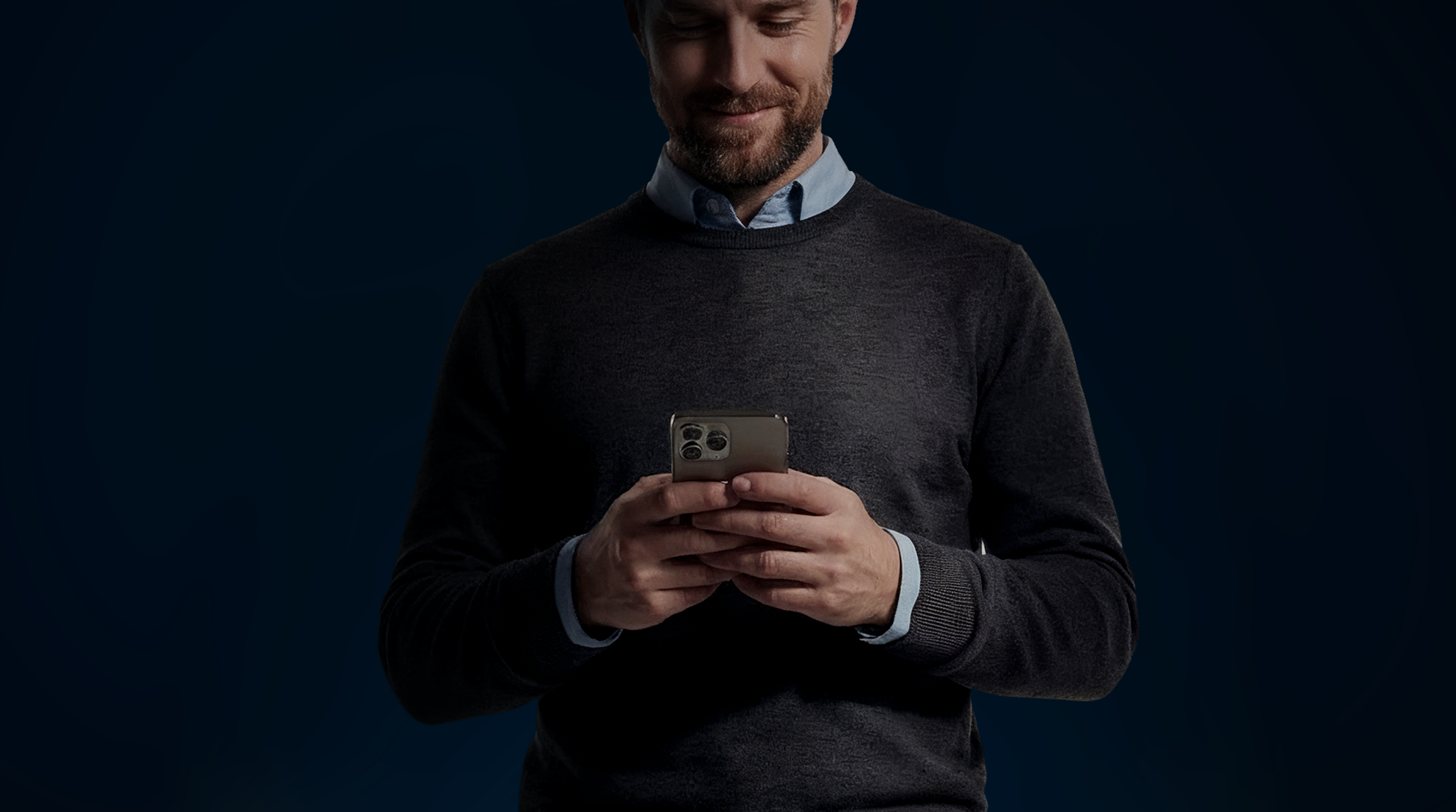 Man with black jersey on mobile