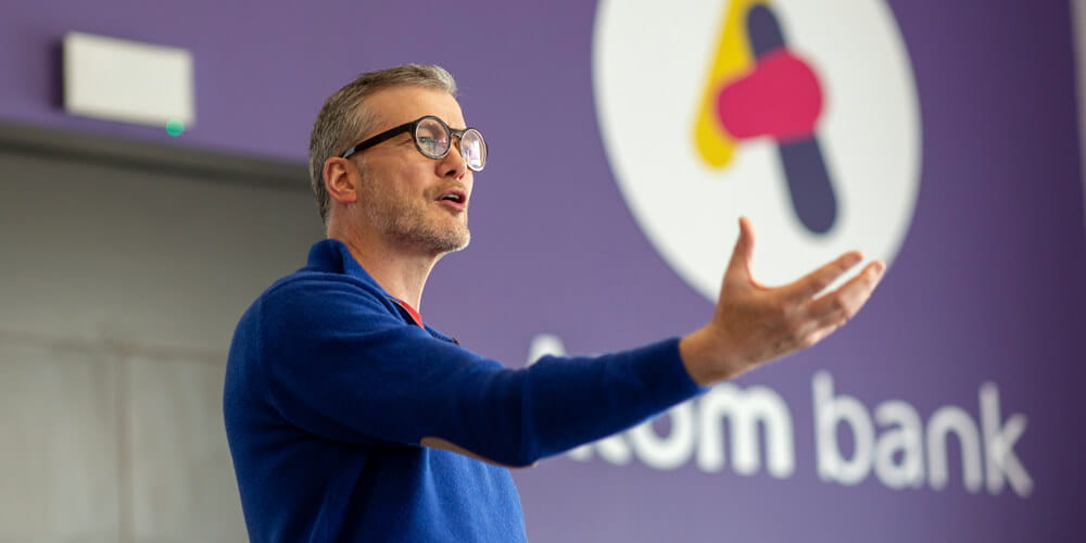 Mark Mullen on stage giving a speech