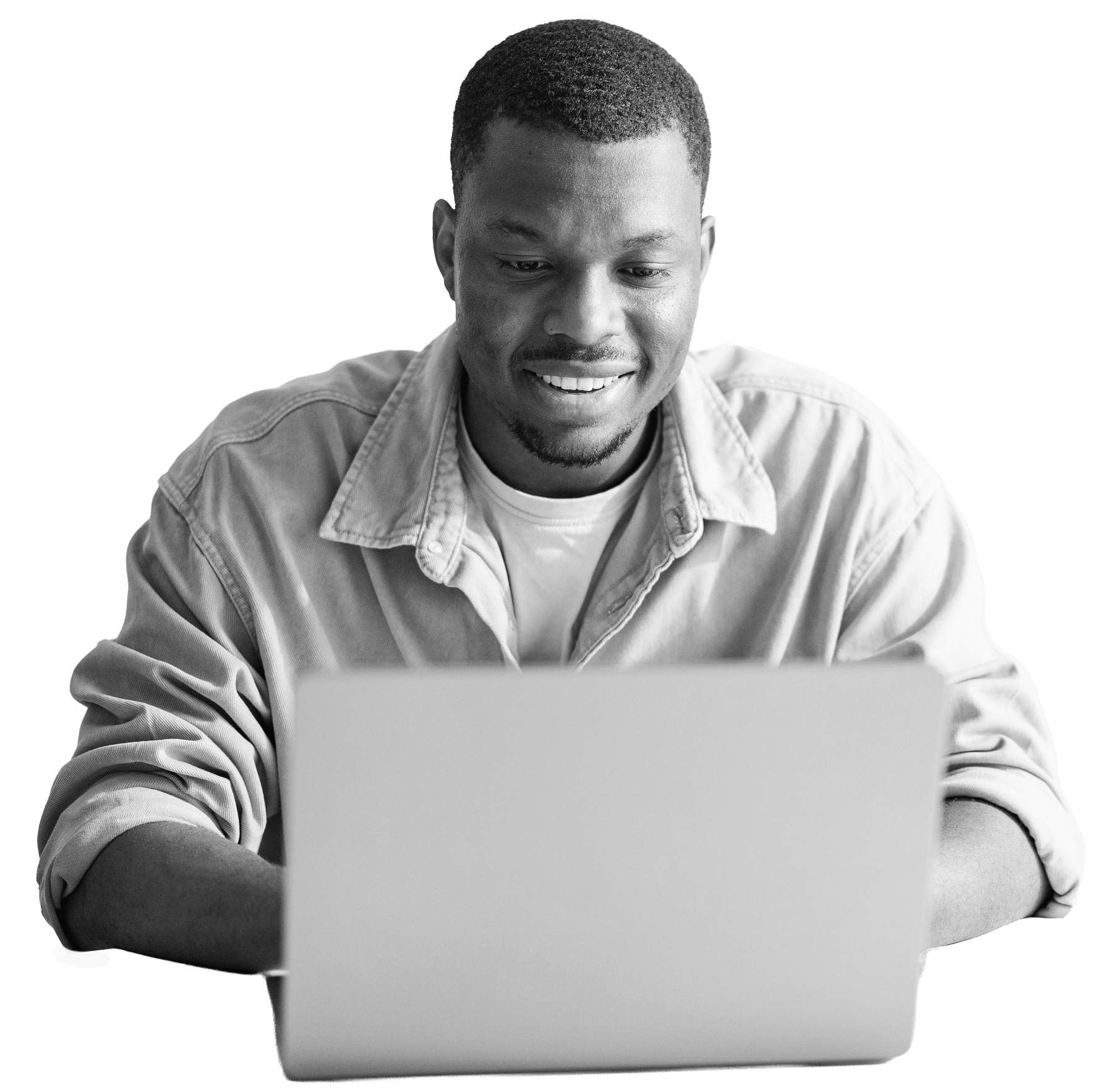 A man looking down at his laptop