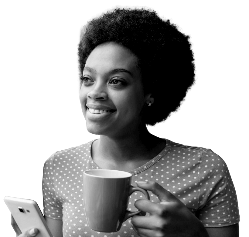 Woman holding coffee mug and phone