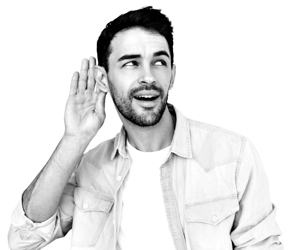 A man holding his hand up to his ear listening