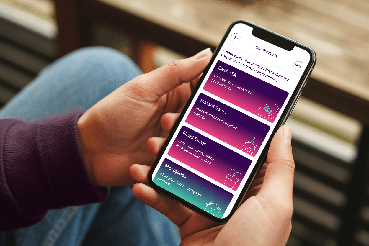 Person holding their phone with the Atom Bank app open