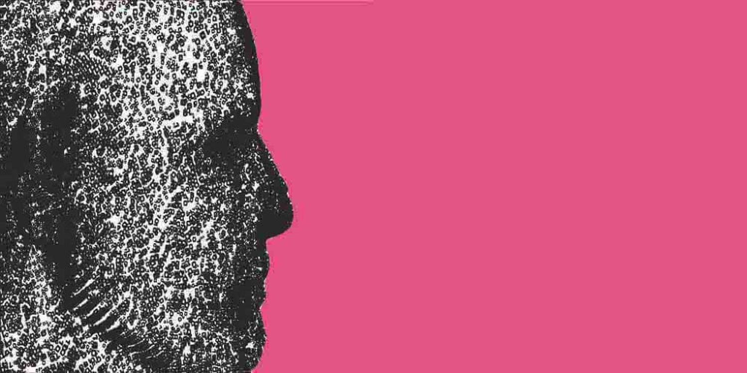 Side profile of a face made up of numbers and letters is on a pink background