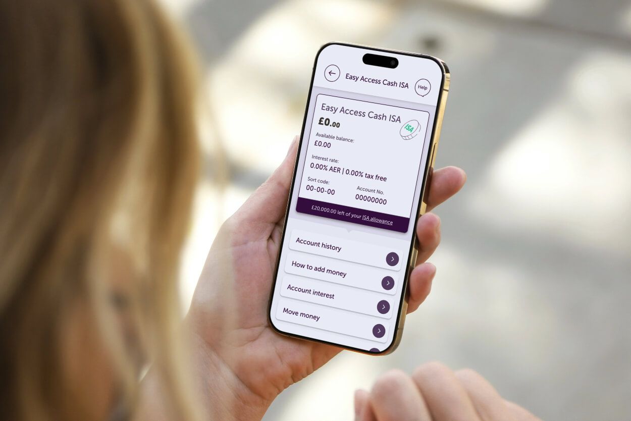 A hand holding a phone with the Easy Access Cash Isa page on it