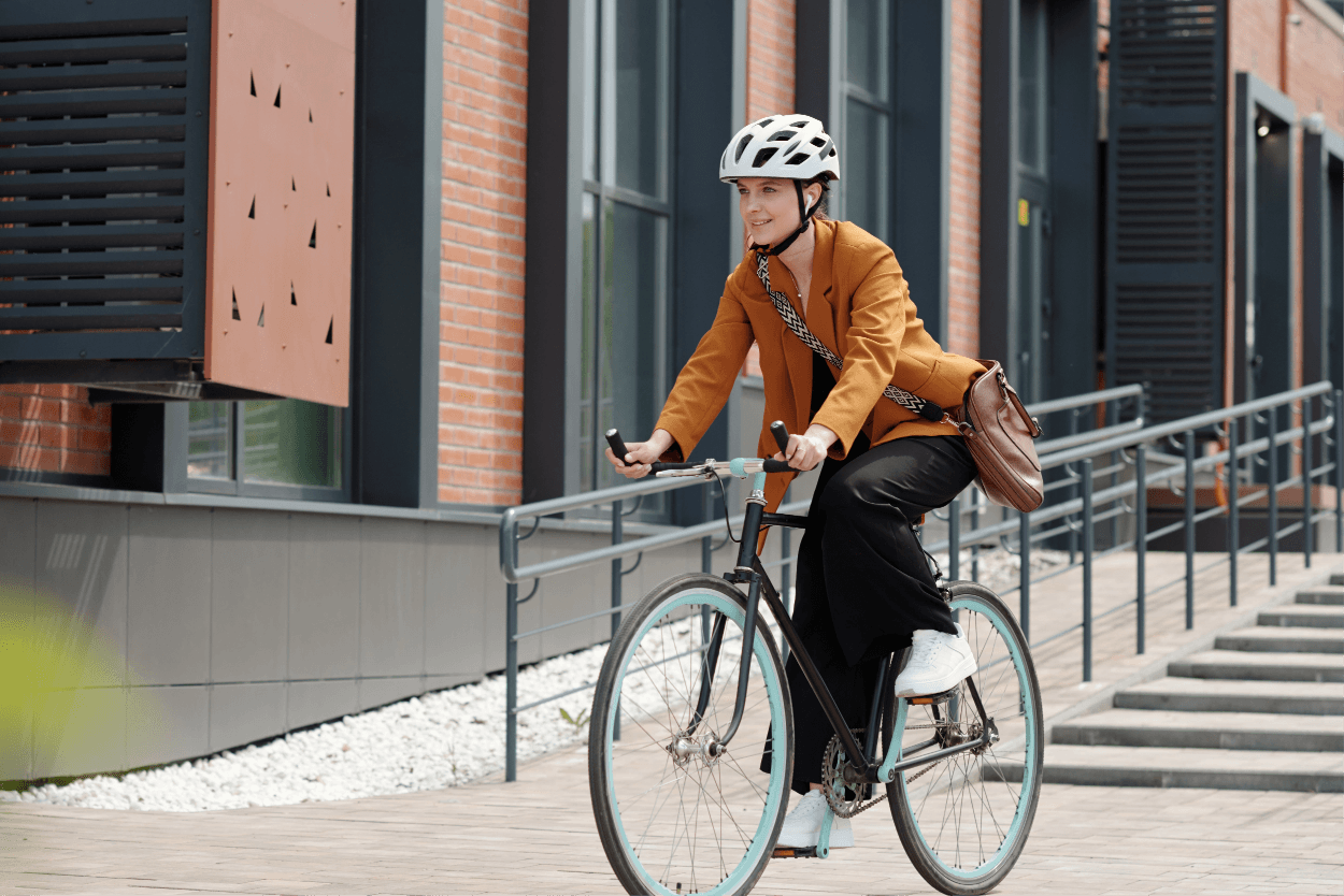 Woman riding bicycle in an urban environment
