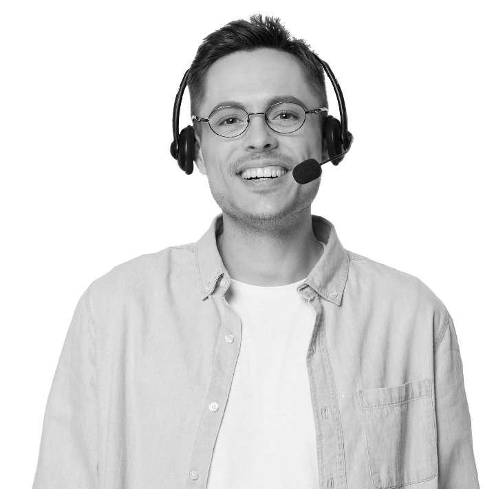 A man with headphones smiling