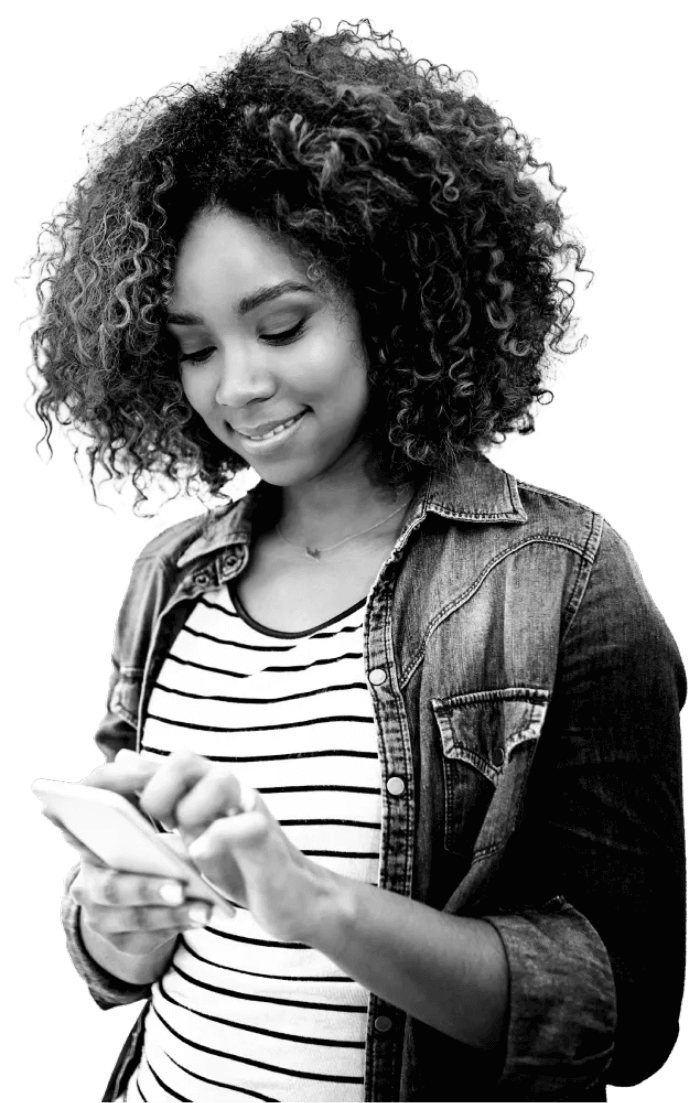 Young woman, in a stripey top, happily contacting Atom bank on her phone