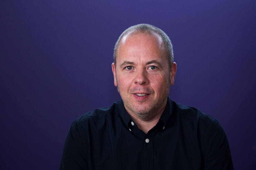 A headshot of Jon Holden