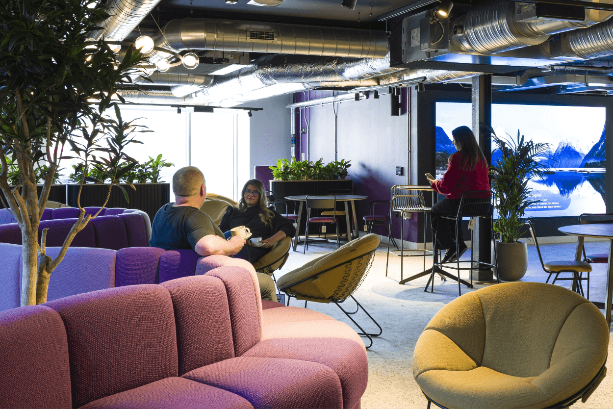 Office lounge with people talking