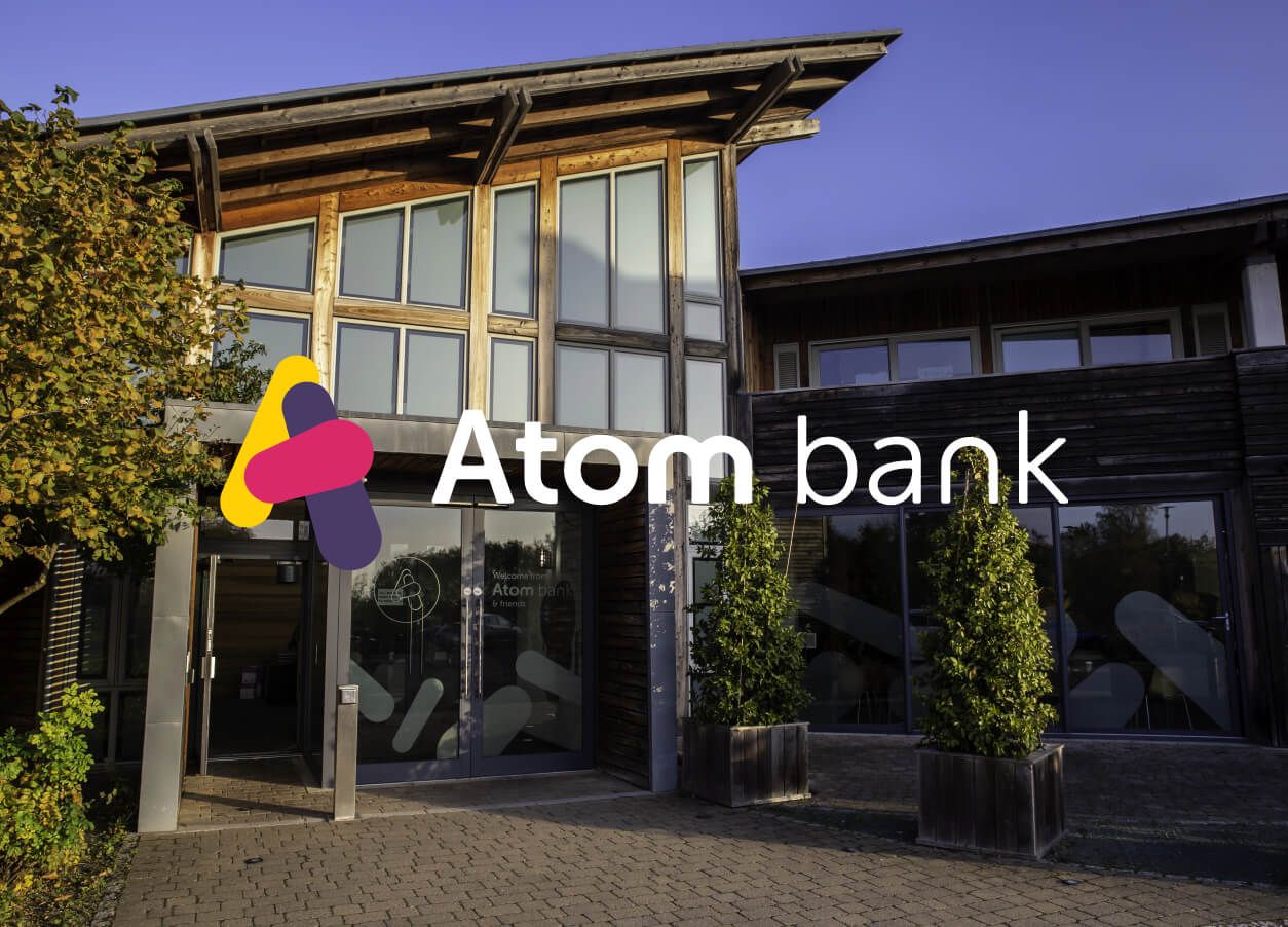 Atom logo on top of an image background of Rivergreen