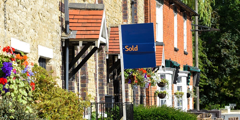 Sold sign outside terraced house