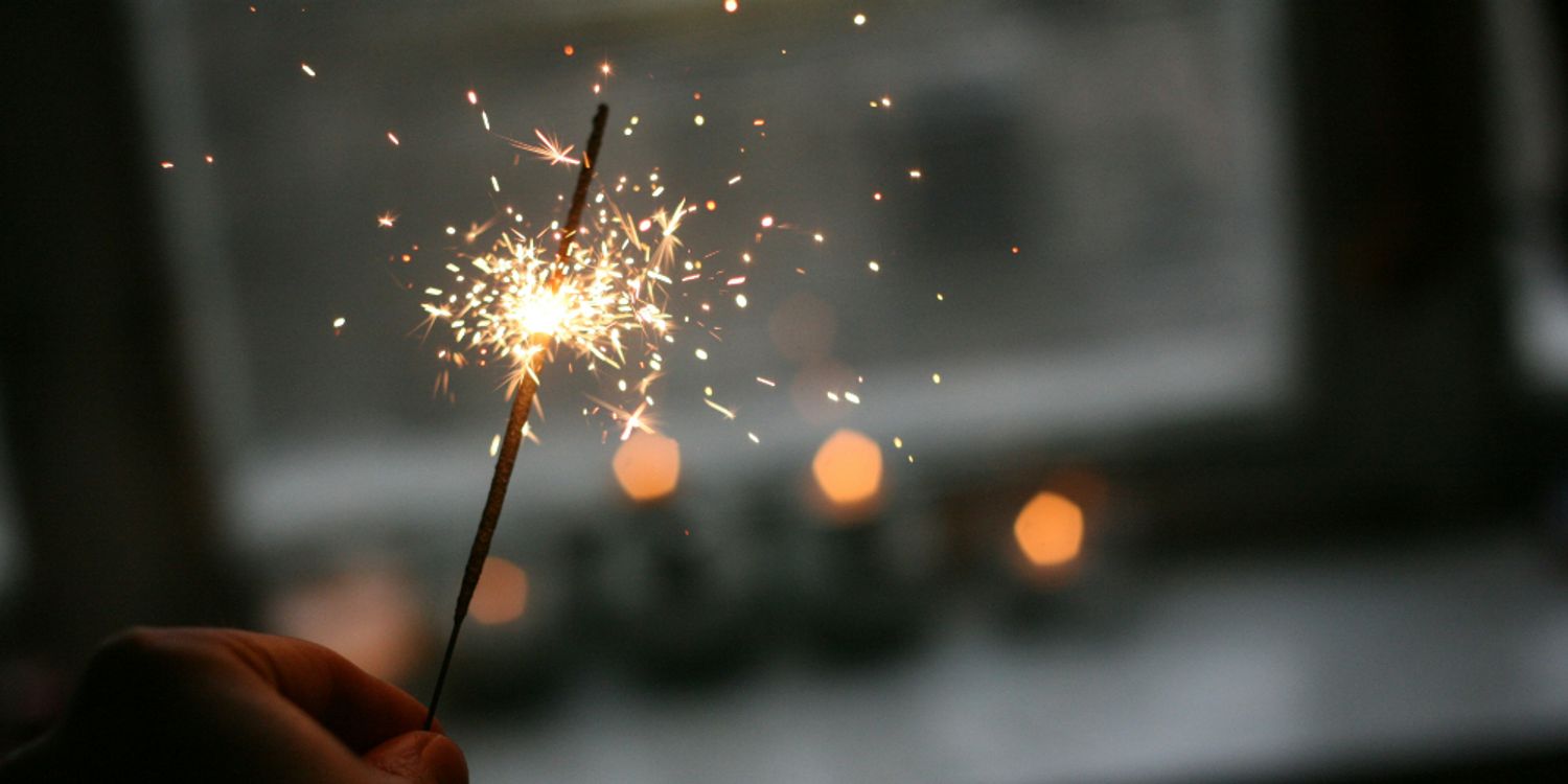 Hand holding a sparkler
