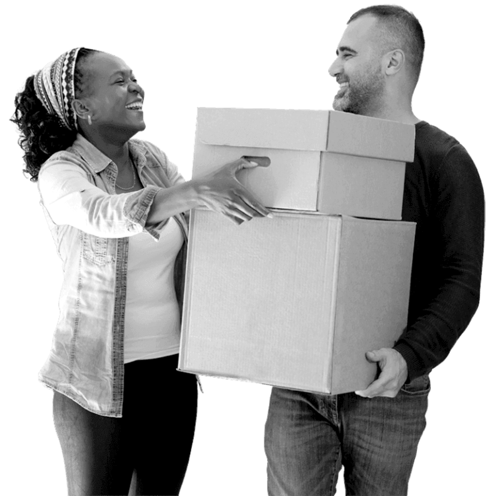 Two people carrying boxes and laughing