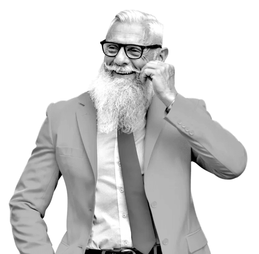 A man wearing a suit and touching his moustache