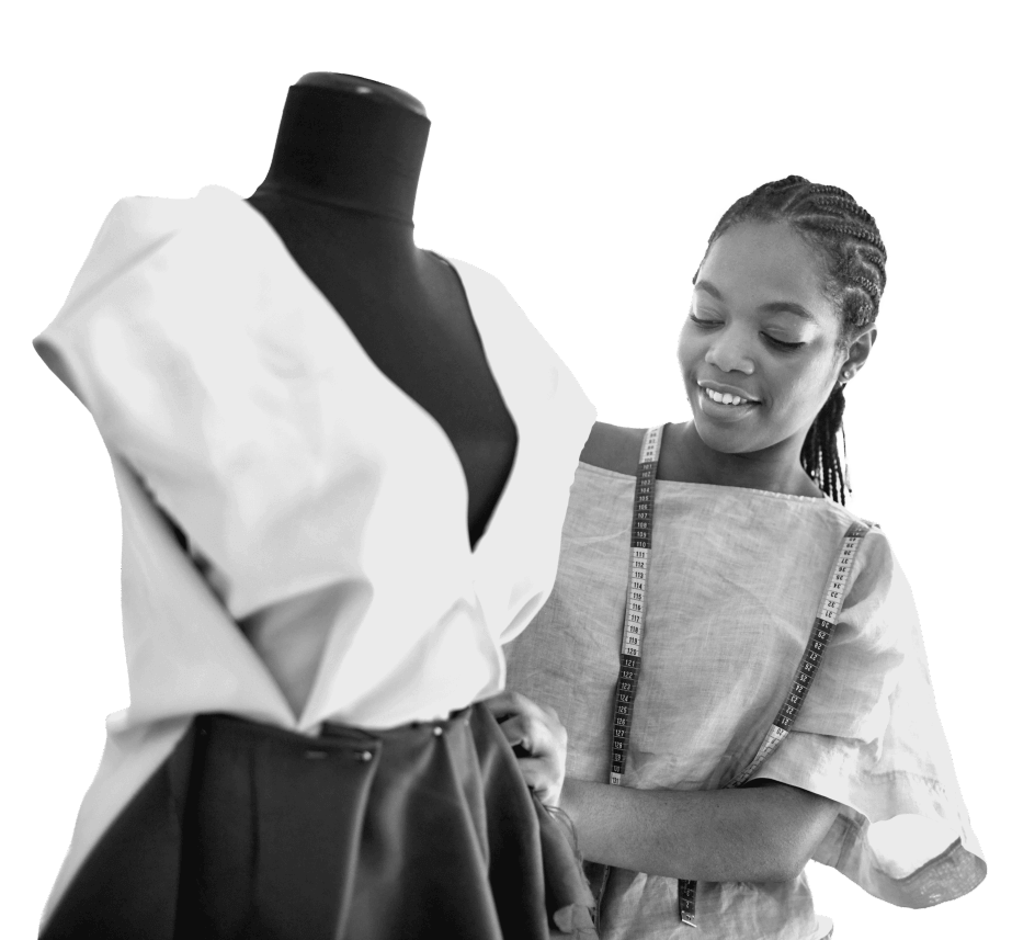 A woman standing next to a mannequin