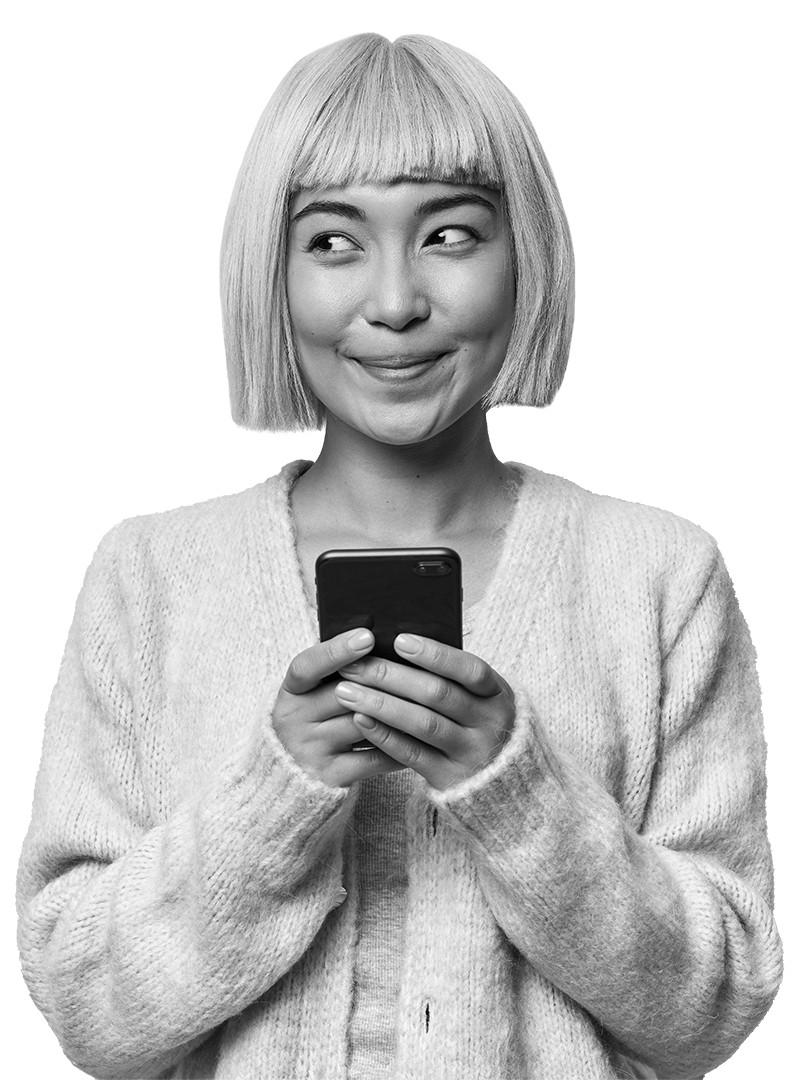 Person happily looks at phone, pointing their finger upwards