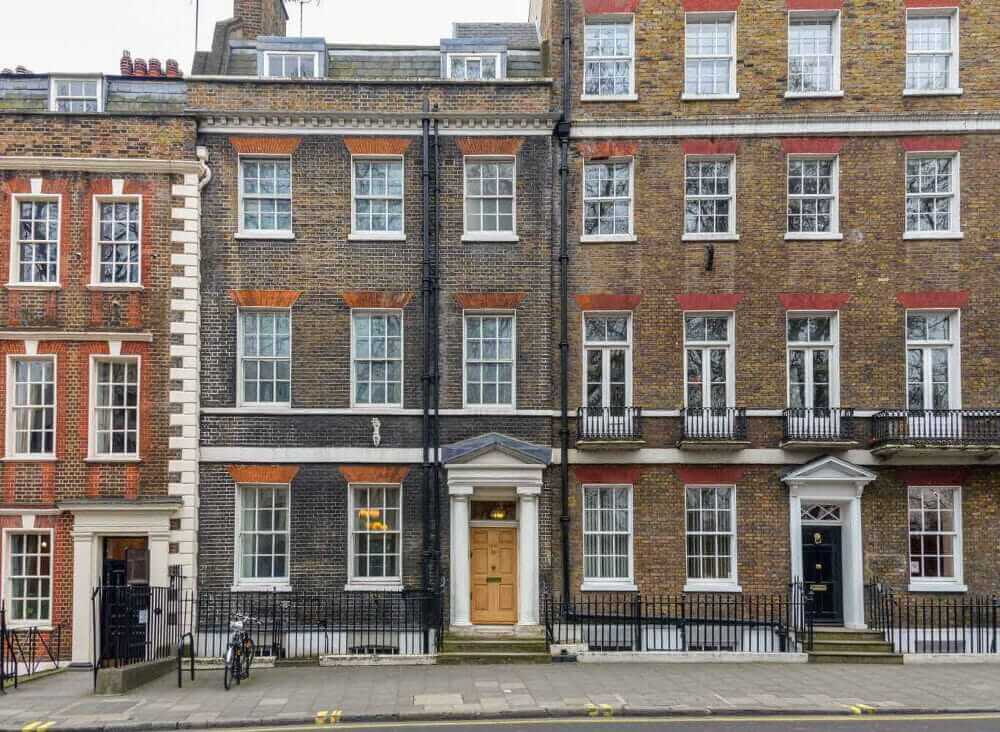 Terrace red and brown brick town houses in a city