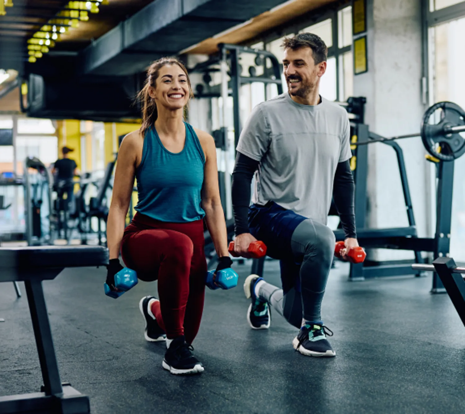 Two people working out at the gym