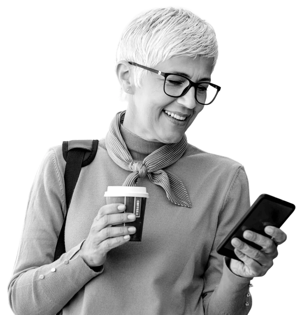 Woman happily checking her Atom Fixed Saver on her mobile phone whilst holding a coffee