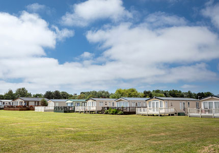 Broadland Sands row of caravan and lodges