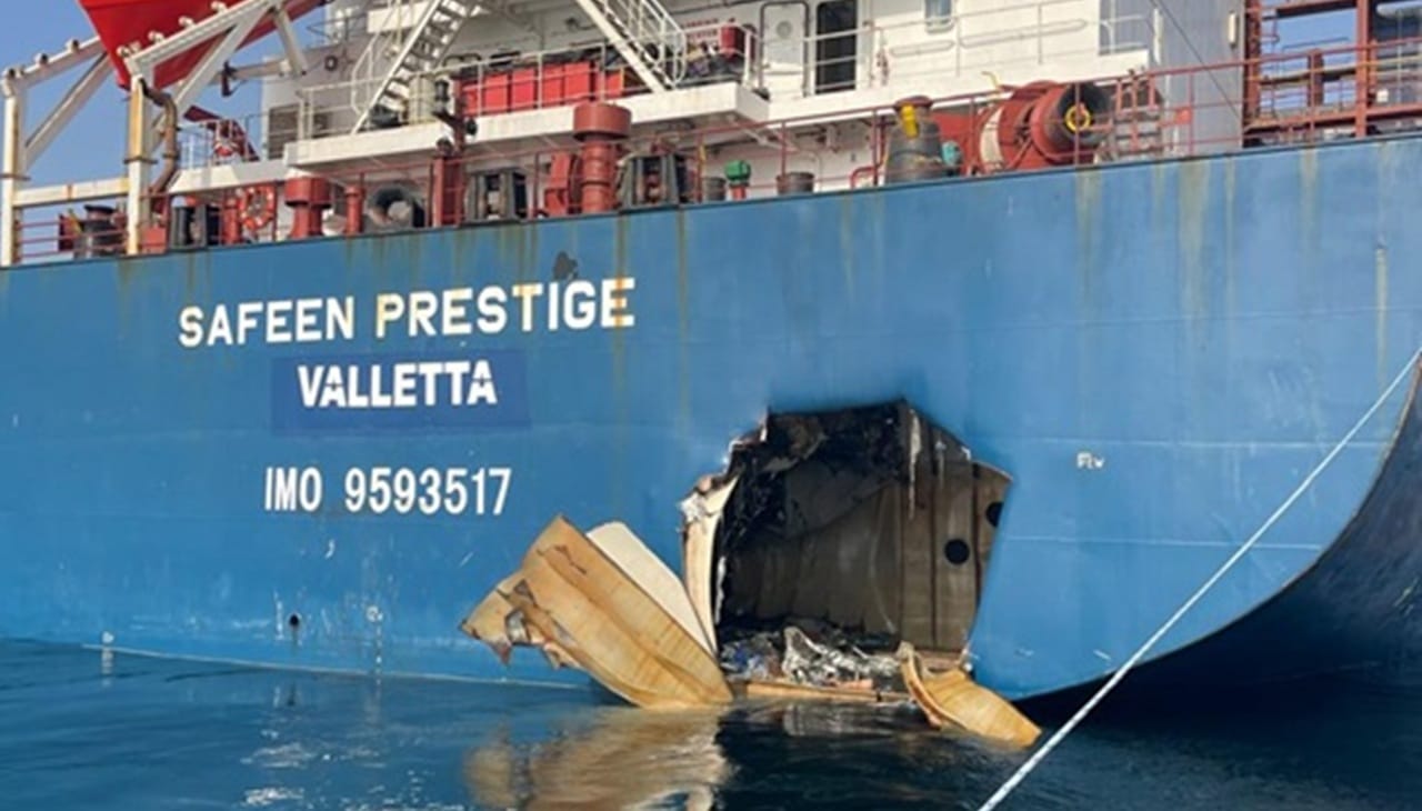 Ship holed by a missile in stern Ship holed by a missile in stern