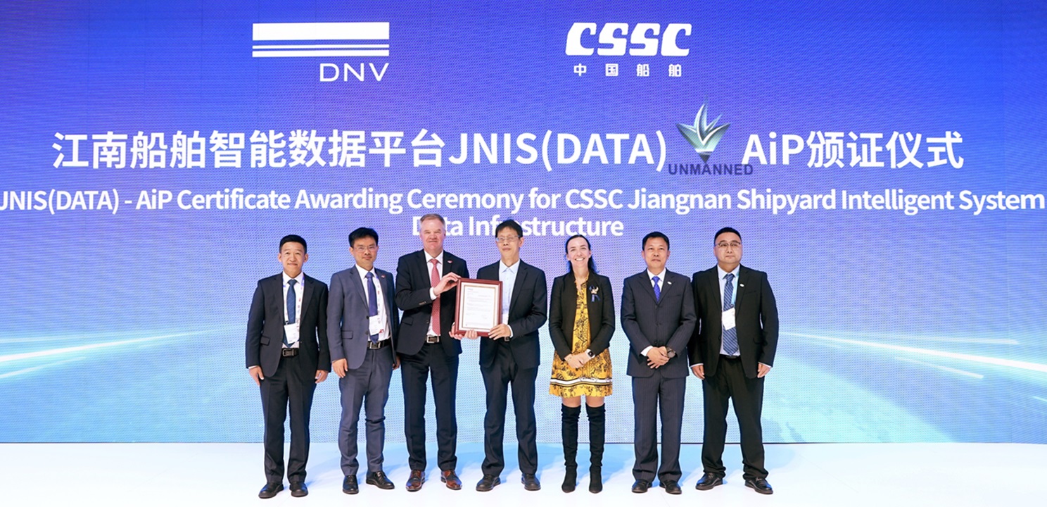 Group of people celebrating certification at an exhibition