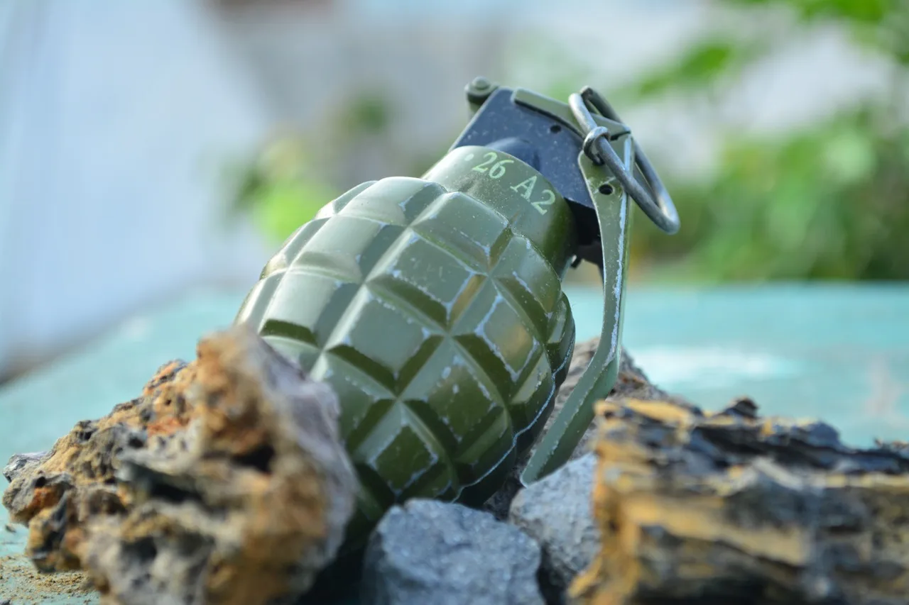 Grenade half buried in the ground
