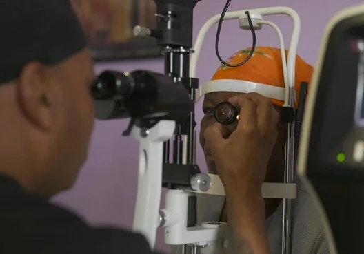An elderly woman having her eye checked out Eye check during the Old Mutual Eye Camp Campaign 2024