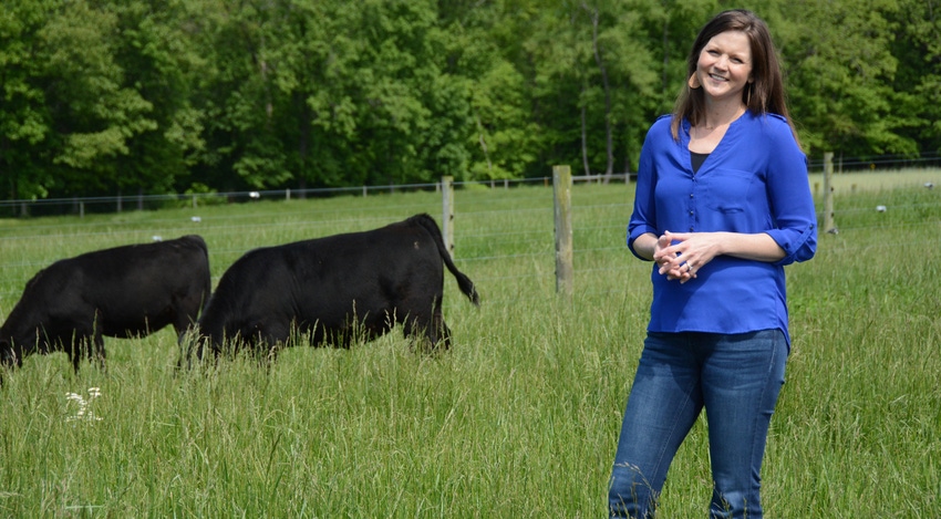 Kimberly Wolter with cattle in pasture